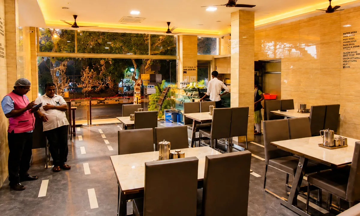 Elegant dining hall at Sathya Garden Resort family restaurant in Coimbatore serving South Indian and multi-cuisine meals